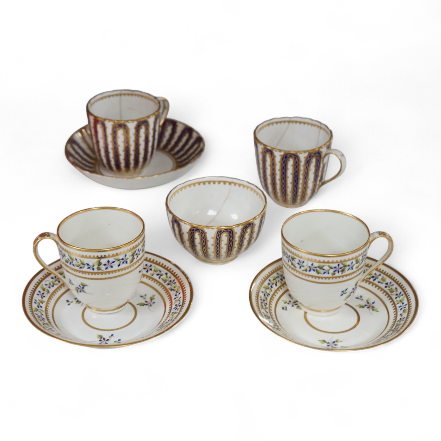 Two late 18th century Derby cornflower pattern coffee cups and saucers and Derby tea and coffee wares, largest 13cm in diameter